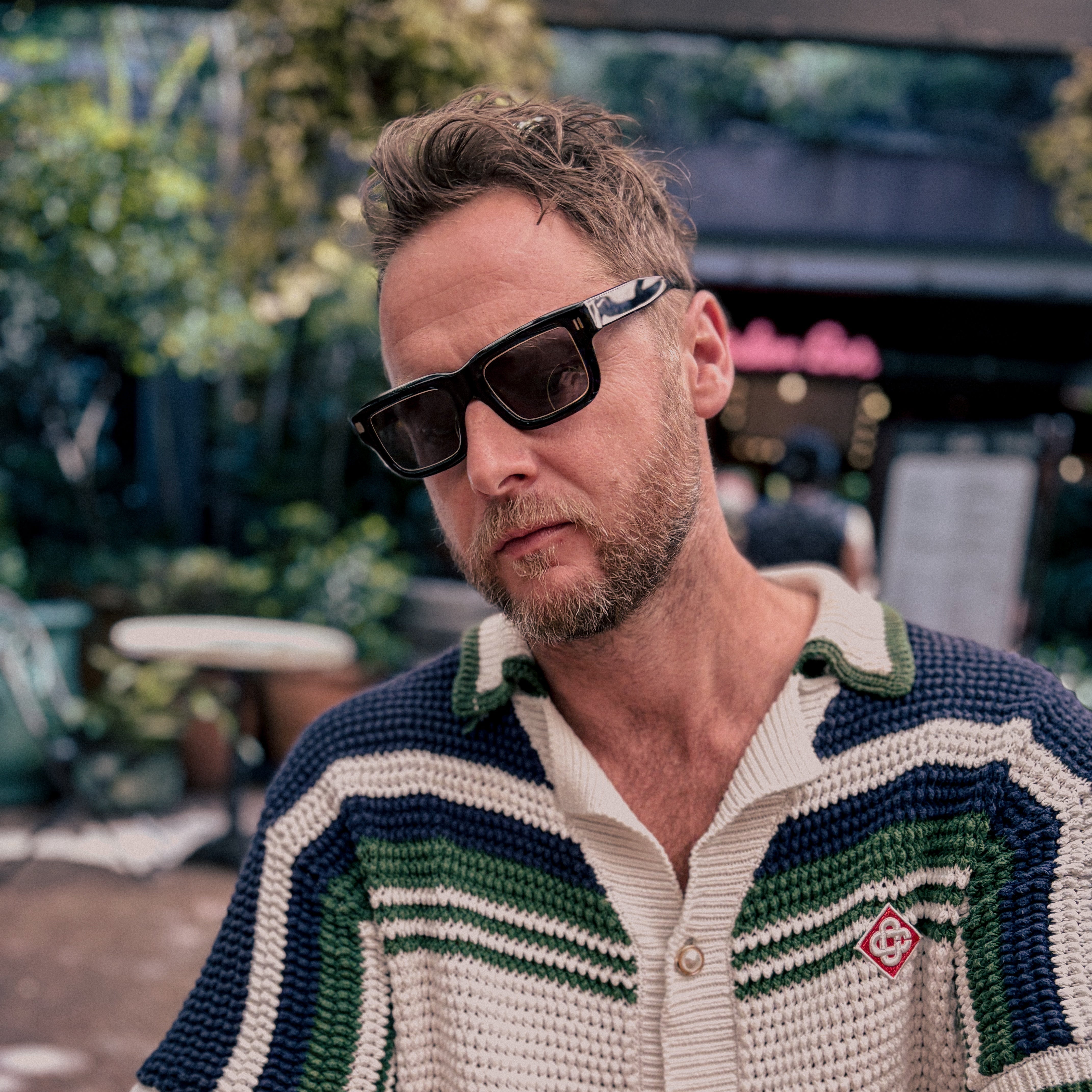 man wearing Jessie Boys sunglasses out doors