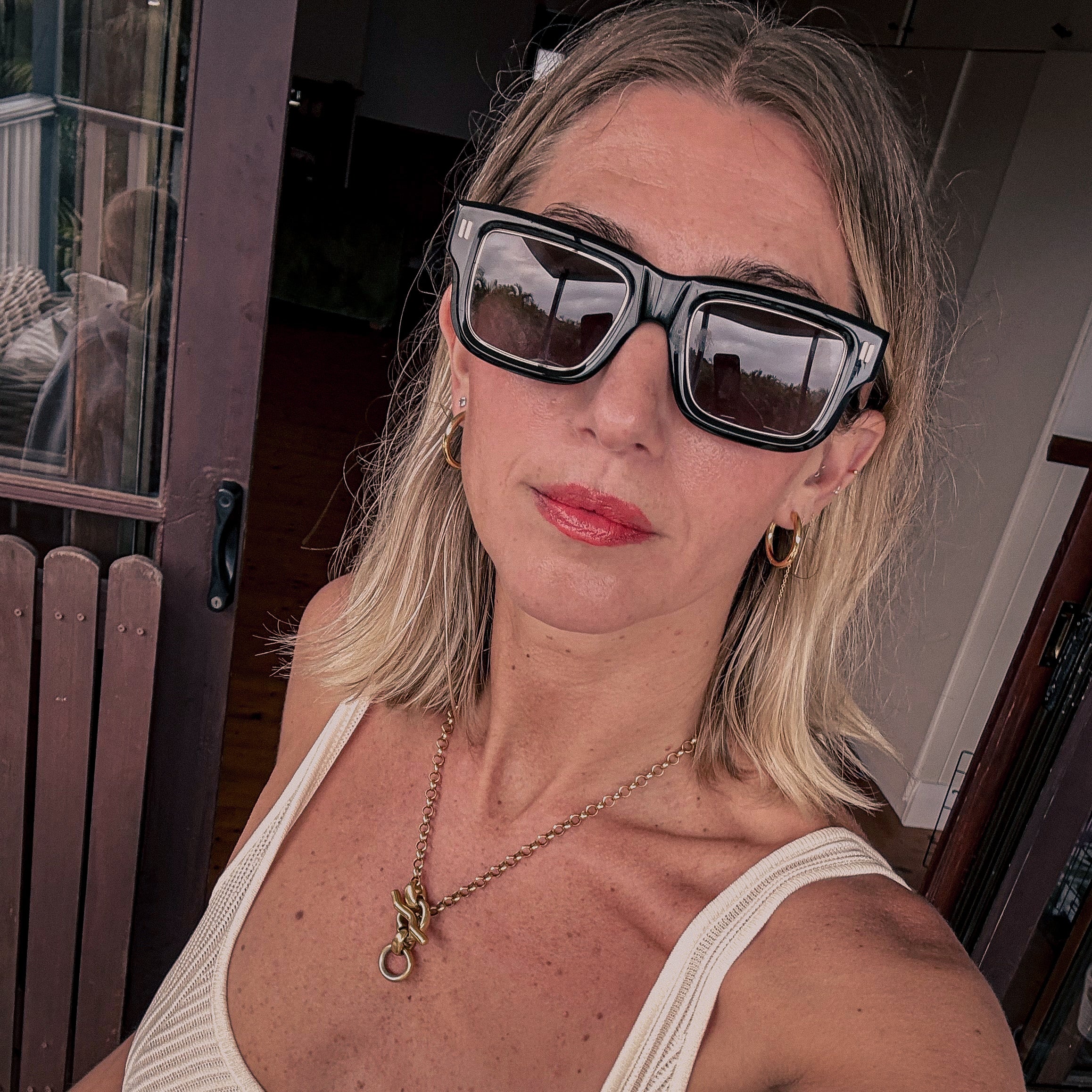 woman wearing Jessie Boys regency green sunglasses